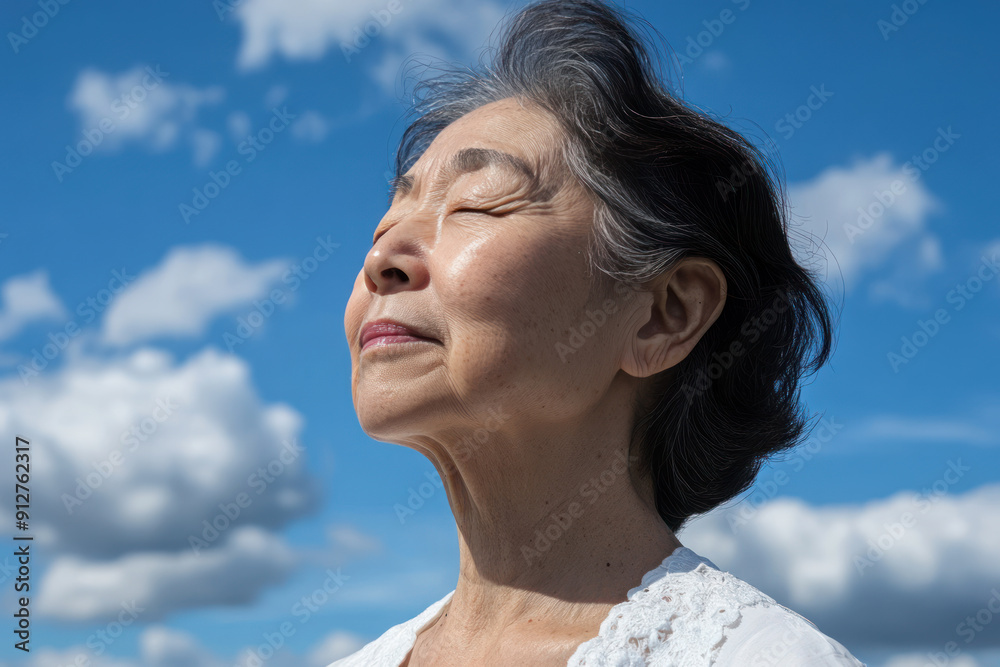 Japanese senior woman taking a breath on a sunny day, mental health Japanese senior woman taking a breath on a sunny day, mental health