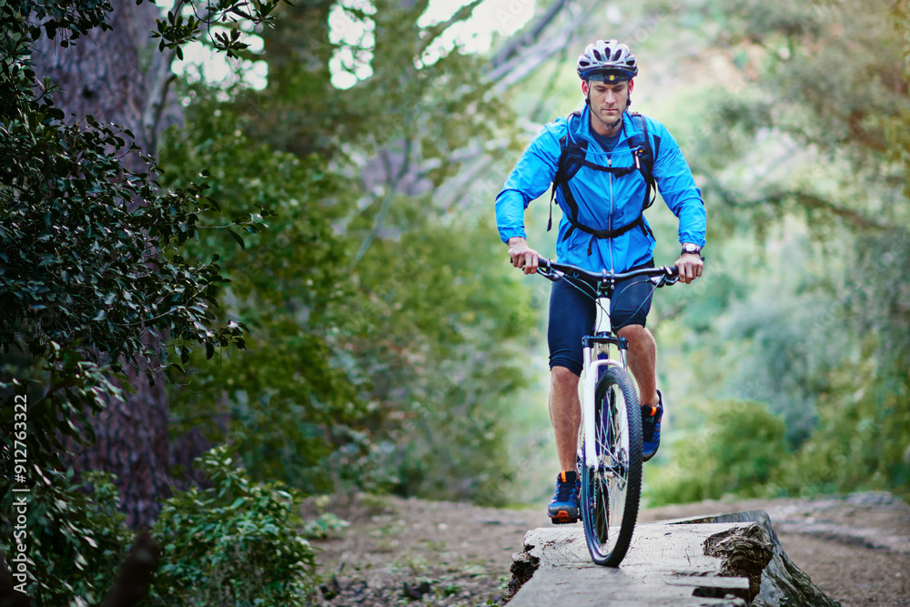 Fototapeta premium Man, bike and mountain path for training in outdoor, performance and extreme sports. Male person, athlete and workout in nature for triathlon, forest and riding exercise for fitness challenge