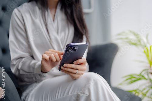 Young asian beautiful woman using smart phone in coffee shop cafe, typing write message on mobile, working, transfer payment, internet banking