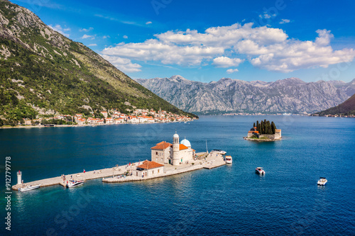 Saint George Island and Church of Our Lady of the Rocks in Perast, Montenegro. Our Lady of the Rock island and Church in Perast on shore of Boka Kotor bay (Boka Kotorska), Montenegro, Europe. photo