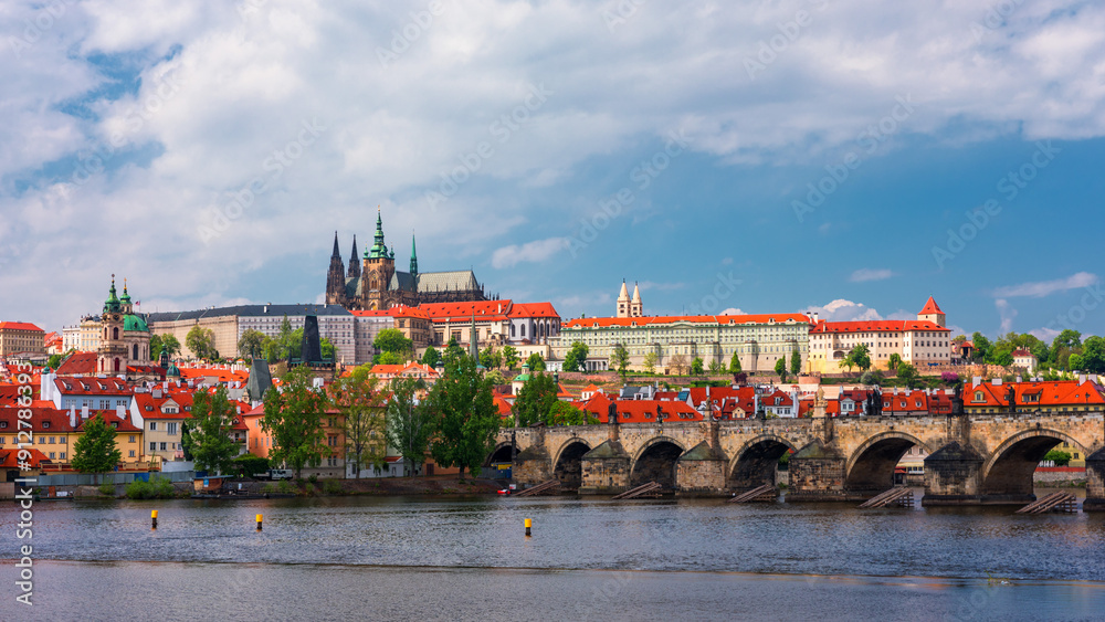 Obraz premium Prague scenic spring view of the Prague Old Town pier architecture Charles Bridge over Vltava river in Prague, Czechia. Old Town of Prague with the Castle in the background, Czech Republic.