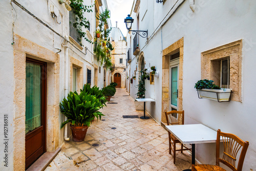 Fototapeta Naklejka Na Ścianę i Meble -  Scenic sight in Locorotondo, Bari Province, Apulia (Puglia), Italy. Characteristic streets in the Locorotondo in Puglia, Italy. Locorotondo is a town of the Metropolitan City of Bari, Apulia, Italy.