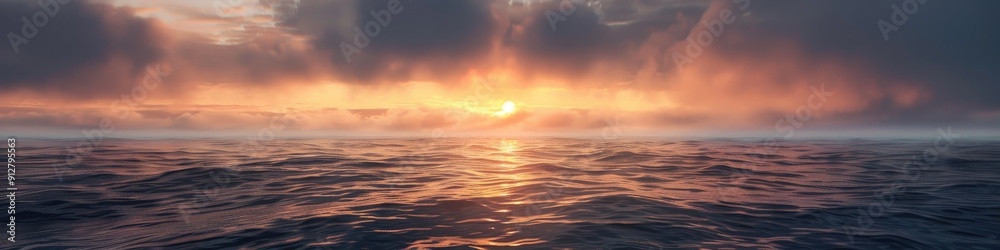Serene ocean sunrise with sun peaking through low clouds casting a pastel glow Serene ocean sunrise with sun peaking through low clouds casting a pastel glow