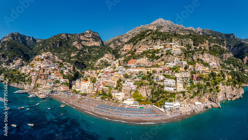 Fototapeta Naklejka Na Ścianę i Meble -  Aerial view of Positano with comfortable beach and blue sea on Amalfi Coast in Campania, Italy. Positano village on the Amalfi Coast, Salerno, Campania. Beautiful Positano, Amalfi Coast in Campania.