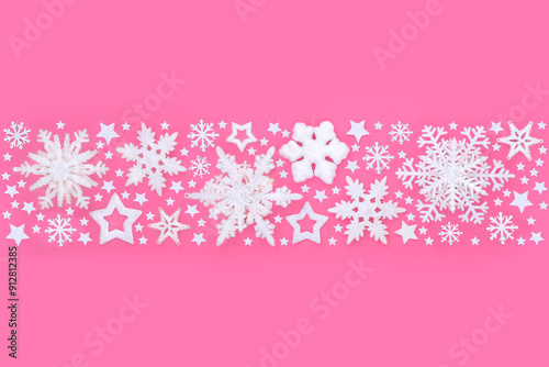 Christmas white snowflake and star tree decoration banner background on pink. Decorative frosted festive fantasy symbols for the holiday season. Copy space.