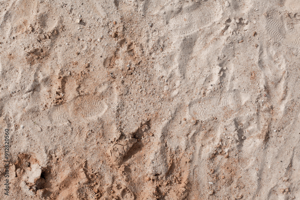 Background of beige, brown beach sand with natural pattern background. top view, flat lay Background of beige, brown beach sand with natural pattern background. top view, flat lay