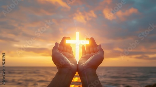 A serene image of hands holding a glowing cross at sunrise, symbolizing hope and faith against a beautiful ocean backdrop.