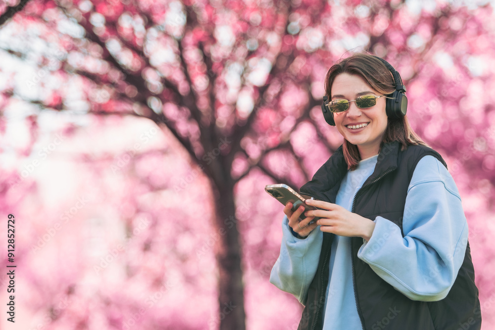woman music lover checking songs on her phone