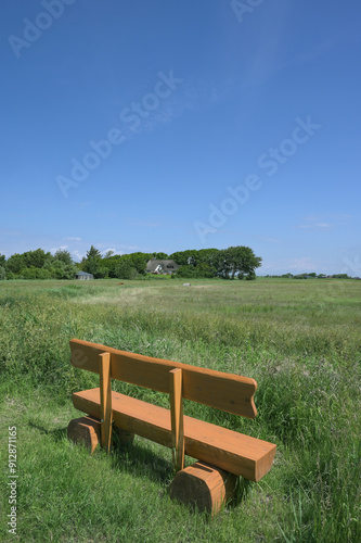 wooden rest Bench on Eiderstedt Peninsula,Westerhever,North Sea,North Frisia,Schleswig-Holstein,Germany photo