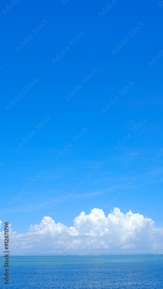 Vertical natural landscape background, white clouds and ocean Vertical natural landscape background, white clouds and ocean