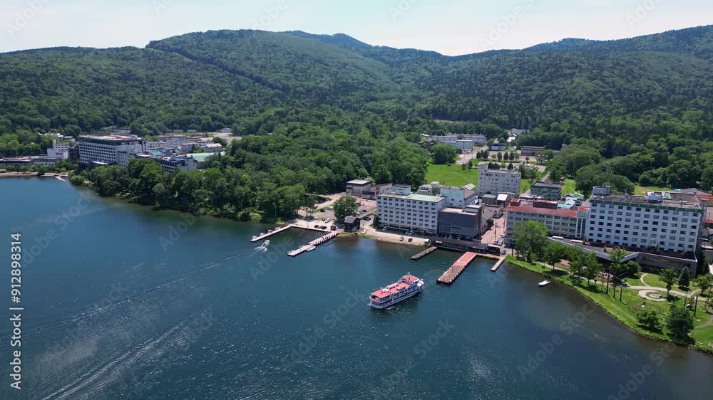 custom made wallpaper toronto digitalLake Akan, Japan: Aerial drone footage of the Akano Onsen resort town by lake Akan in the Akan-Mashu National Park in Hokkaido in summer in Japan. 