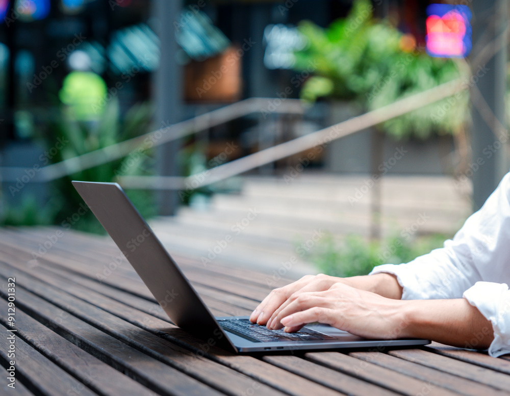 Businessman in casual look using laptop and working in startup business at cafe coffees shop in public locations ,work from home and anywhere meeting online, searching internet for job in social media