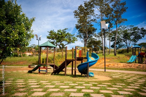 Colorful playground with slides and climbing structures in a park on a sunny day. Brazil photo