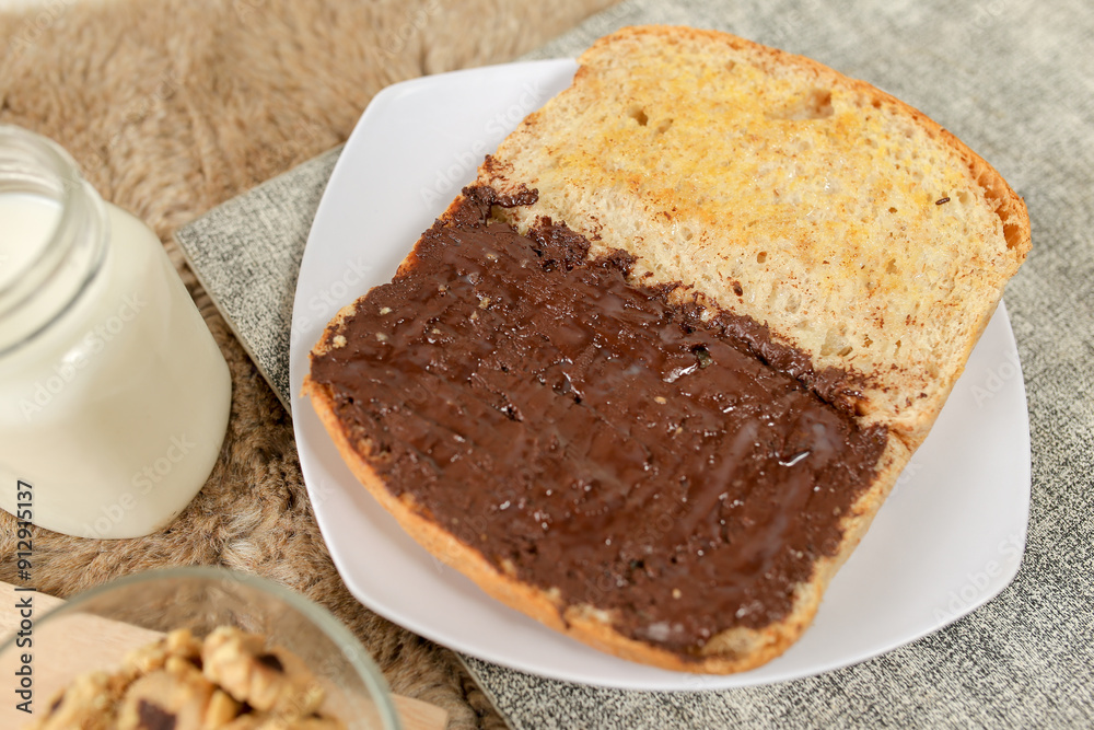 Bread with chocolate spread filling, milk and snack for breakfast
Bread with chocolate spread filling, milk and snack for breakfast