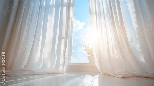 Bright sunlight streaming through white curtains on a large window