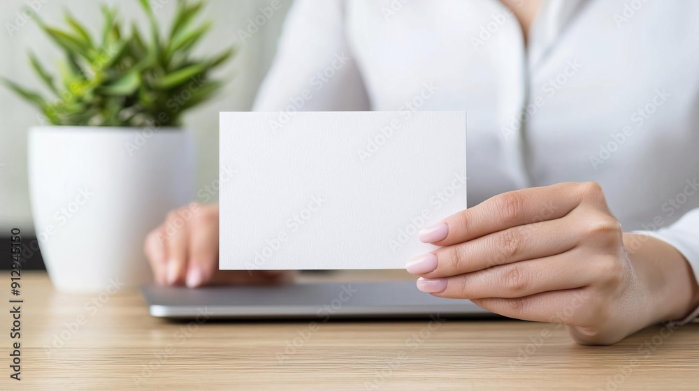 Woman holding blank card, mockup for business card, invitation, or message.