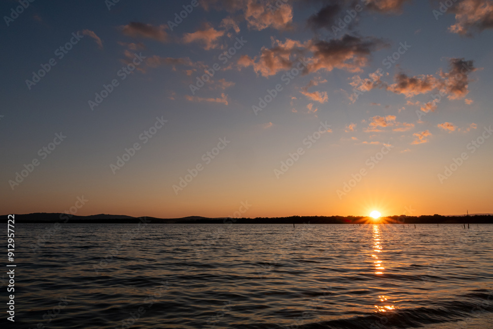 Fototapeta premium Sunset with its blue and orange colors at the Valparaíso Reservoir, Zamora, Castilla y León, Spain.