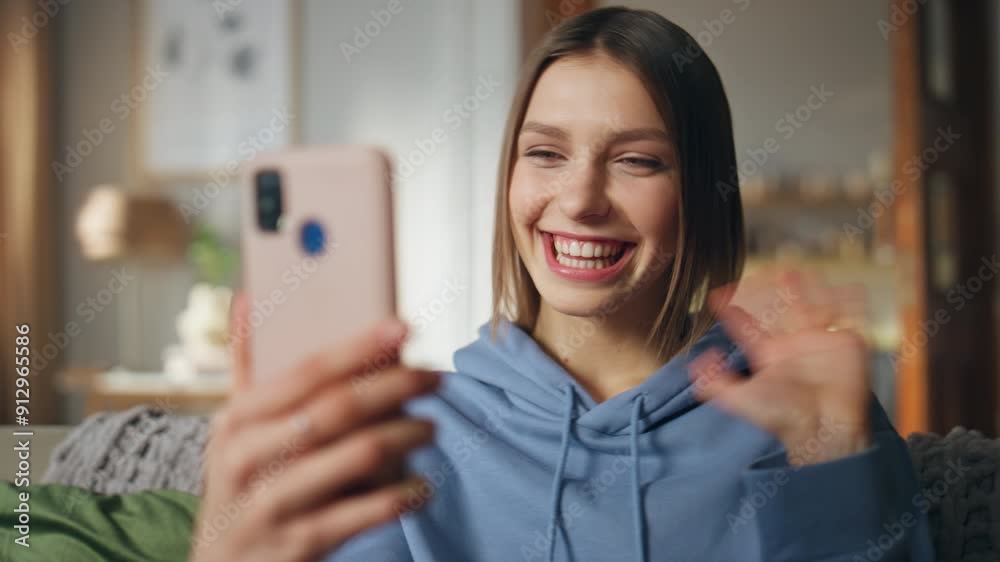 Joyful lady waving cellphone web camera at video call sitting home couch closeup Joyful lady waving cellphone web camera at video call sitting home couch closeup