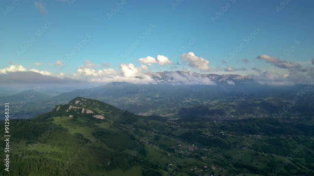 Aerial drone shot of Valea Prapastiilor as seen from the sky of Magura on a green sunny summer day. The romanian Carpathian mountains Piatra Craiului area seen from above. Top down footage of canyon.
Aerial drone shot of Valea Prapastiilor as seen from the sky of Magura on a green sunny summer day. The romanian Carpathian mountains Piatra Craiului area seen from above. Top down footage of canyon.