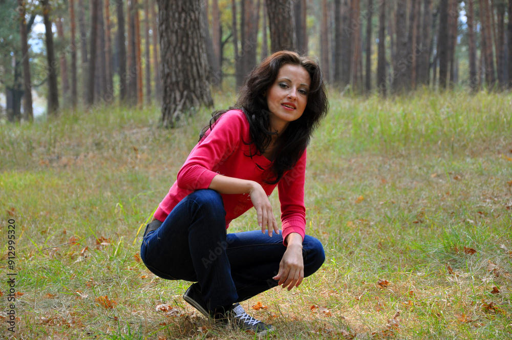 Girl sitting in autumn. Girl on autumnal landscape. Autumn girl in park. Central park landscape in fall season. Fall woman in park. Autumn woman outdoor. Woman in fall nature Girl sitting in autumn. Girl on autumnal landscape. Autumn girl in park. Central park landscape in fall season. Fall woman in park. Autumn woman outdoor. Woman in fall nature