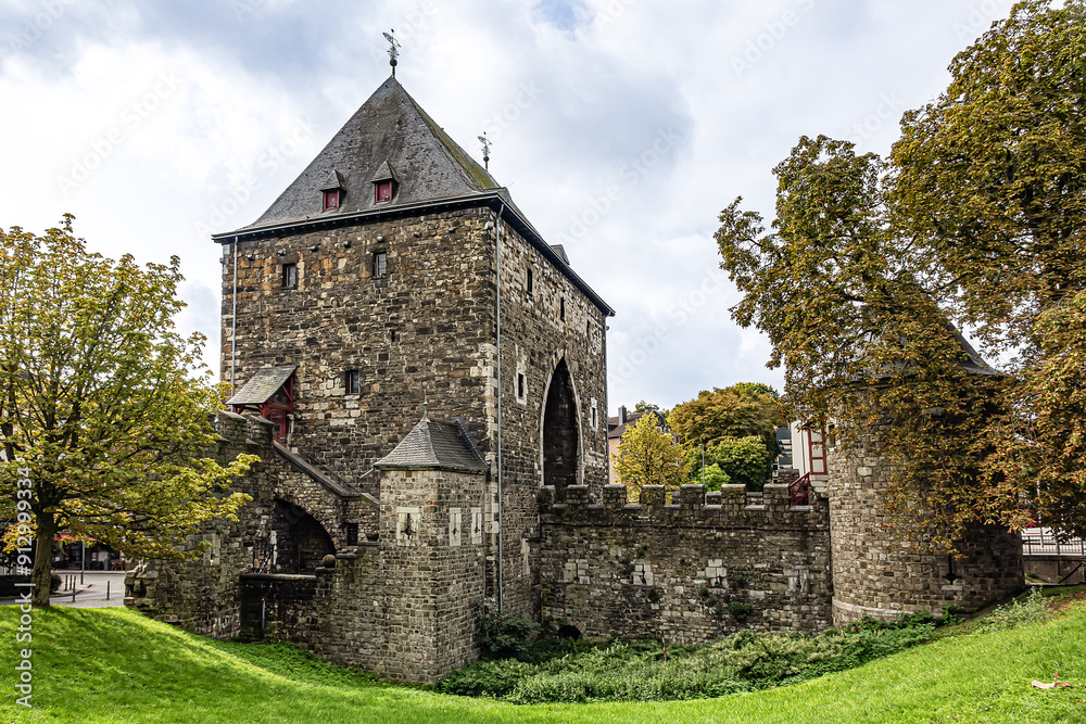 The Ponttor (known as Bruckenpforte or Bruckenthor in XVII -XVIII centuries) - one of the two remaining gates of the original medieval wall of Aachen, North Rhine-Westphalia, Germany. The Ponttor (known as Bruckenpforte or Bruckenthor in XVII -XVIII centuries) - one of the two remaining gates of the original medieval wall of Aachen, North Rhine-Westphalia, Germany.