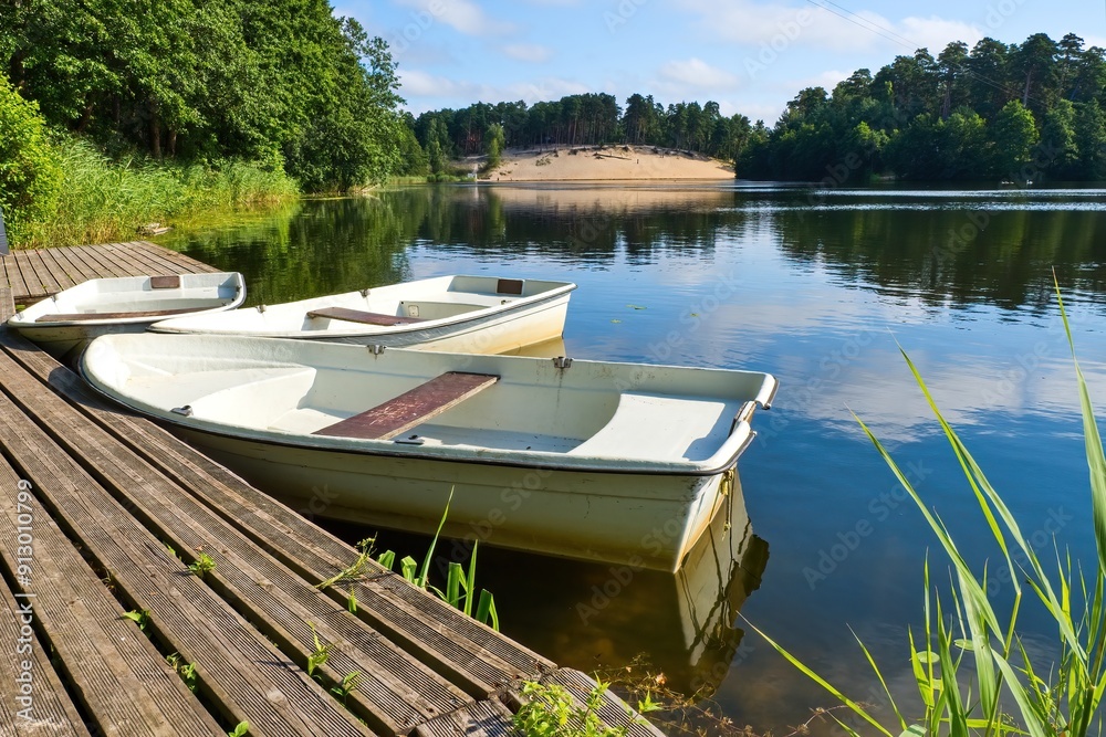 Three plastic boats. Summer holiday by the water. Three plastic boats. Summer holiday by the water.