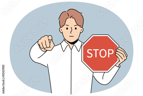 Man with stop sign in hands says access is denied and points finger at screen warning about stopping cooperation. Businessman calls to stop work and start audit or change conditions