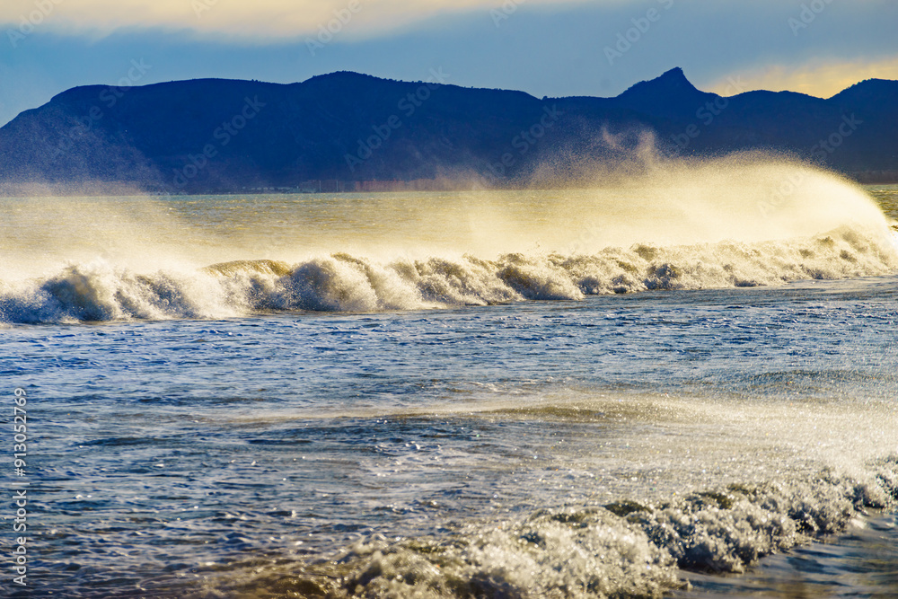 Sea waves forming white foam on sunny day. Sea waves forming white foam on sunny day.