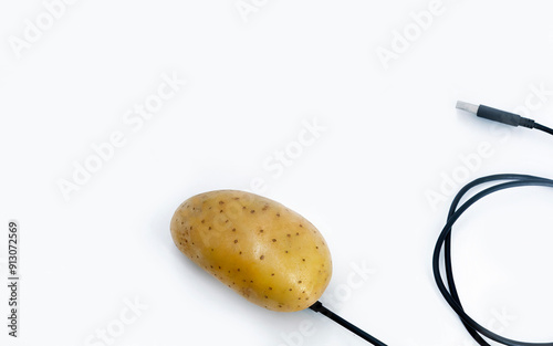 Potato as a computer mouse with USB cable on white background, advertising, sale, promotion, accessories, potato power, battery concept, gadget, electrode science photo