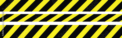 Warning tape with yellow and black diagonal stripes.