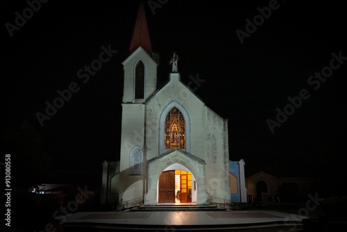 CORDOBA, ARGENTINA, APRIL 30, 2022: Nightscene of parish of Our Lady of Carmen in La Cumbre, illuminated from inside