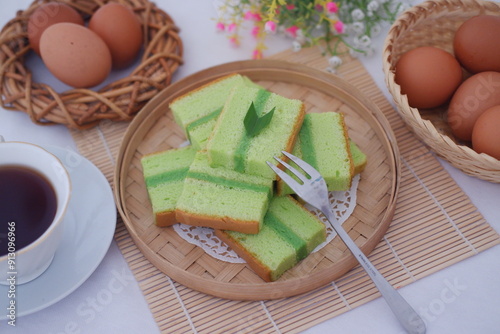 pandan cake on a wooden plate. Selective focus. photo