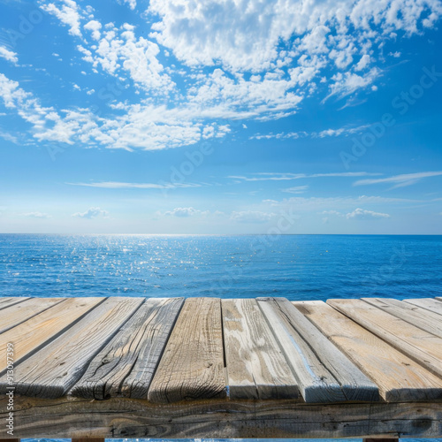 Wooden Plank Overlooking the Sparkling Blue Ocean and a Cloudy Sky
