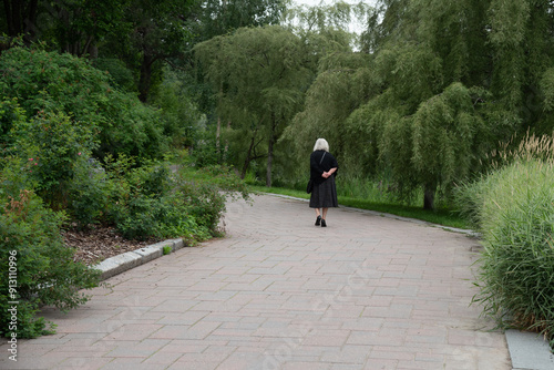 Senior Woman walking in a public park