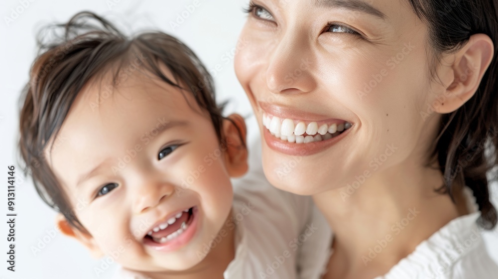 Loving gaze of an Asian mother towards her cheerful baby, emphasizing their deep emotional bond. Loving gaze of an Asian mother towards her cheerful baby, emphasizing their deep emotional bond.