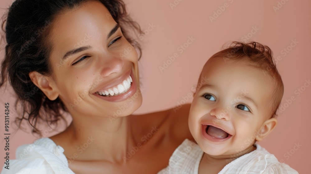 Affectionate bond between a Latino mother and her smiling baby, highlighted in a serene studio setting. Affectionate bond between a Latino mother and her smiling baby, highlighted in a serene studio setting.