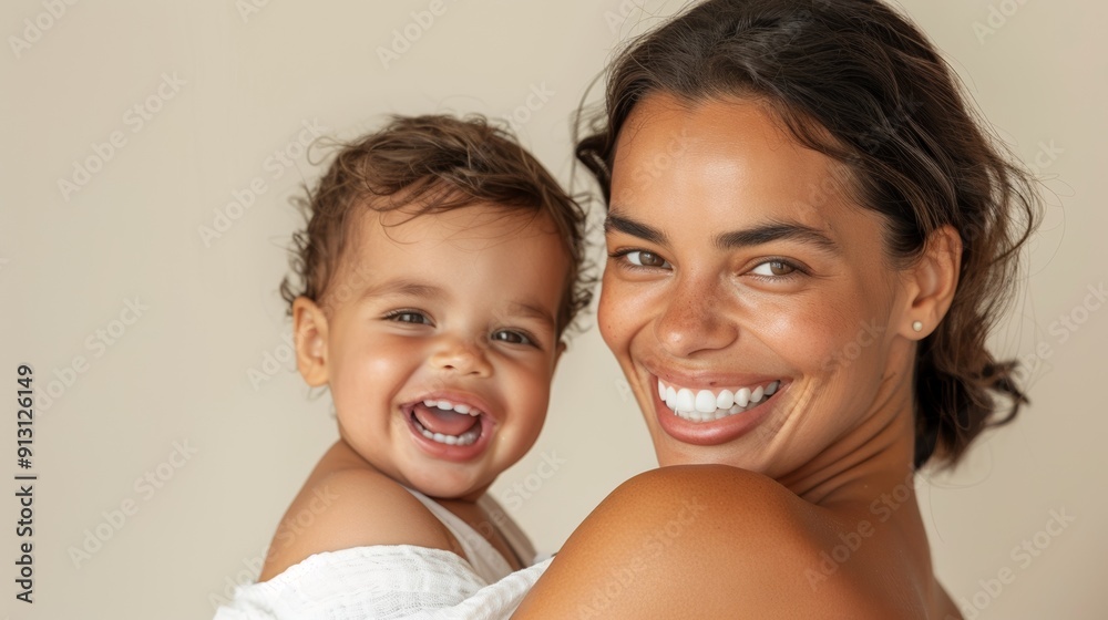 Affectionate studio photo of a mother and her happy baby, radiating love and warmth. Affectionate studio photo of a mother and her happy baby, radiating love and warmth.