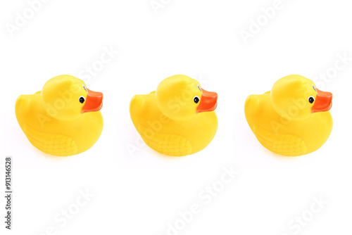 Fotografie yellow rubber ducks in a row on white