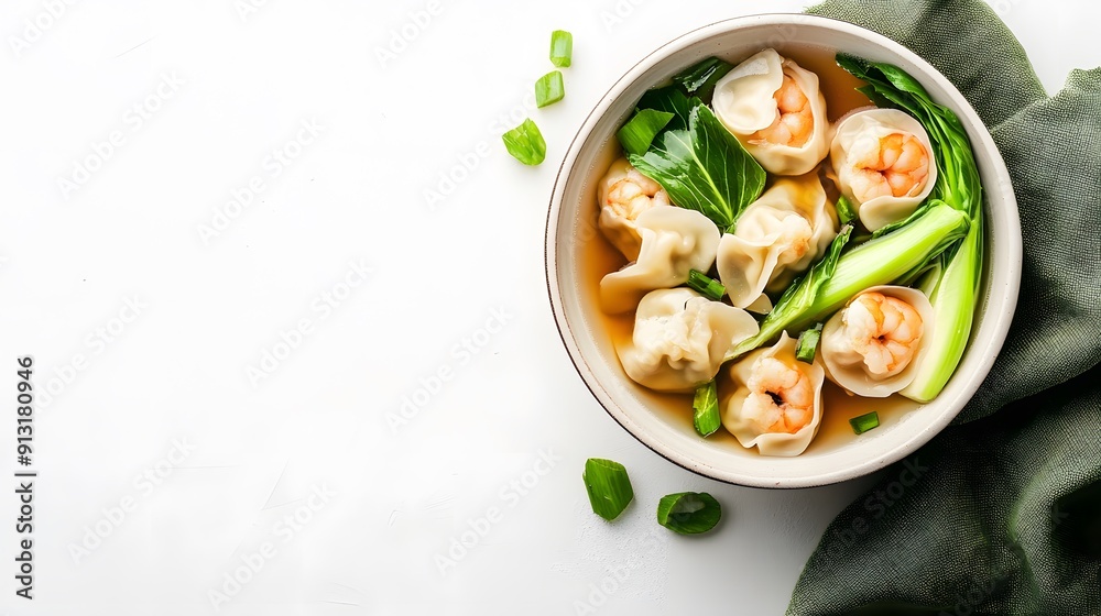 A realistic top view of a bowl of traditional wonton soup with shrimp wontons and bok choy, set against a clean white background, chinese food. A realistic top view of a bowl of traditional wonton soup with shrimp wontons and bok choy, set against a clean white background, chinese food.