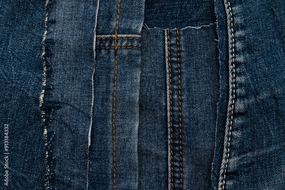 Texture from torn pieces of denim. Jeans texture. Material for sewing clothes Texture from torn pieces of denim. Jeans texture. Material for sewing clothes