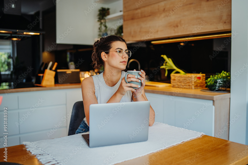 Young caucasian woman working from home on laptop Young caucasian woman working from home on laptop