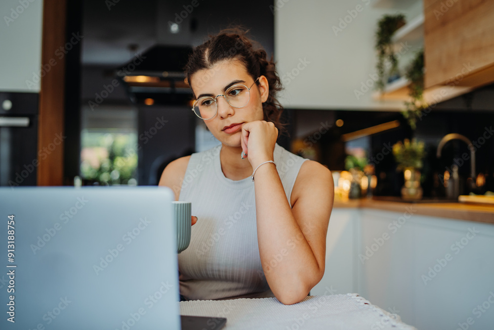 Young caucasian woman working from home on laptop Young caucasian woman working from home on laptop