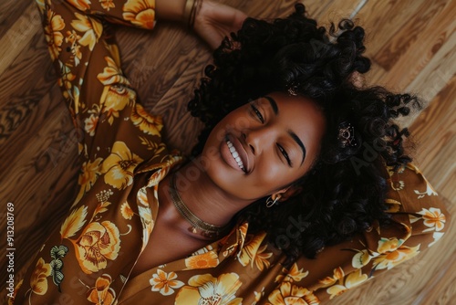 Woman Laying on Floor in Brown Floral Shirt