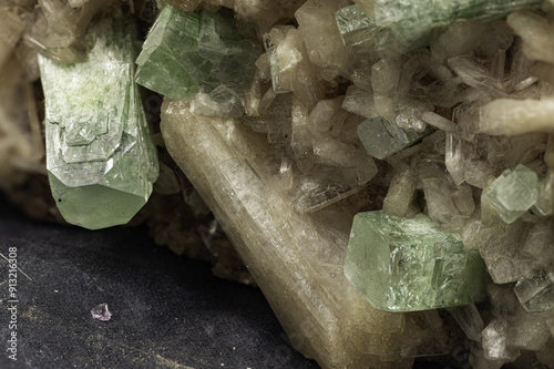 This close-up image captures the unique textures and colors of apophyllite and stilbite crystals, emphasizing their geological significance photo