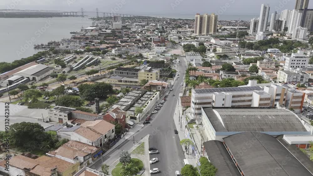 Drone flies north in Cidade Alta toward Teatro Alberto Maranhão with river on left and Atlantic Ocean on the right in Natal, Rio Grande do Norte, Brazil