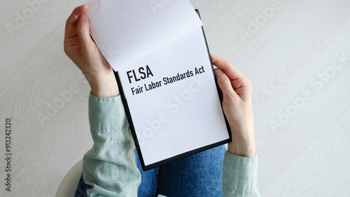 Business photo shows printed text FLSA Fair Labor Standards Act photo