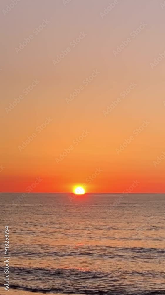 Sunrise above sea water early in Spanish beach. vertical orientation footage Sunrise above sea water early in Spanish beach. vertical orientation footage