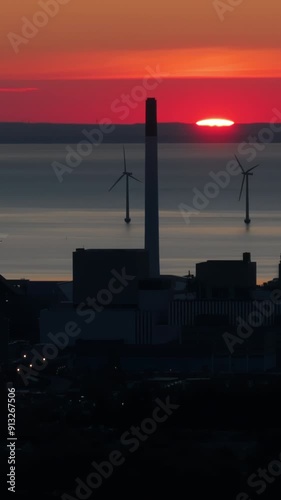 Copenhagen, Denmark - July 24, 2024: Aerial drone view of Amager Bakke in Amager at sunset. Vertical photo