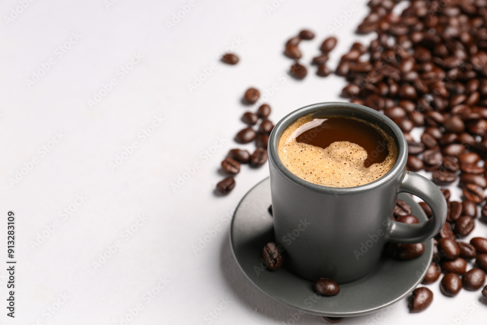 Cup of coffee and beans on grey background Cup of coffee and beans on grey background
