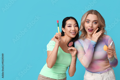 Two diverse young women hol...